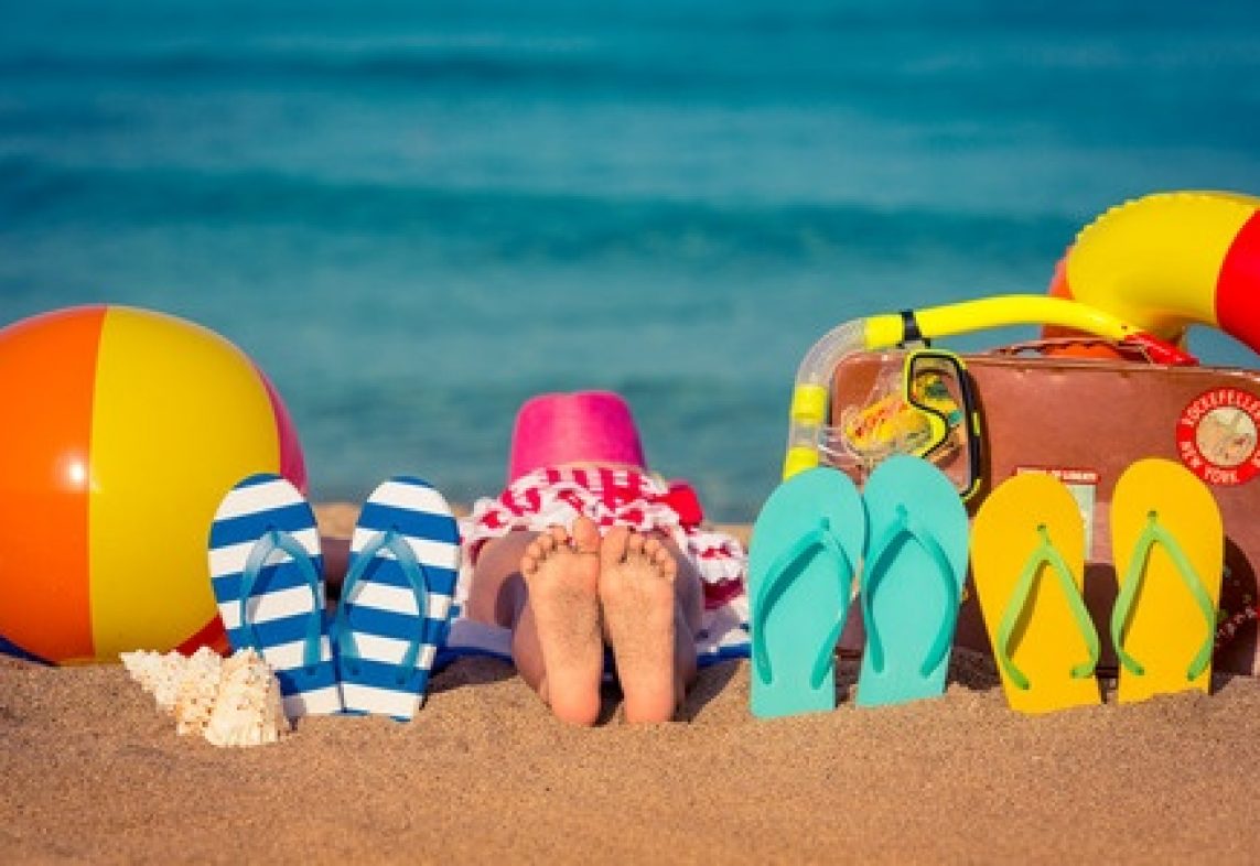 39362964 - flipflops and children feet on the beach. summer vacation concept