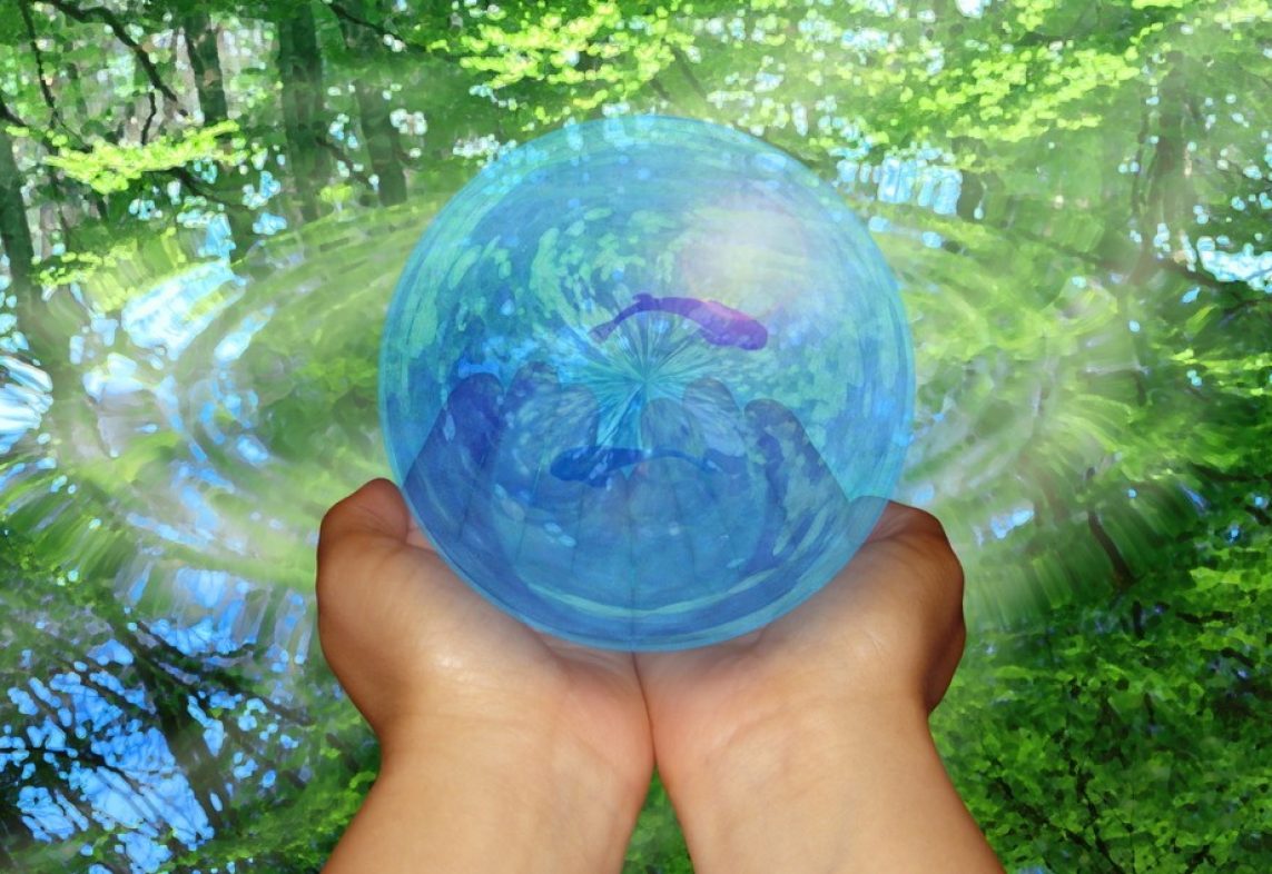 Woman holding globe in hands